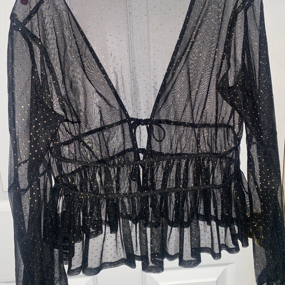 This is a black and gold blouse.